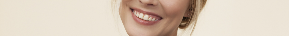 Woman with dental implants in West Sussex smiling